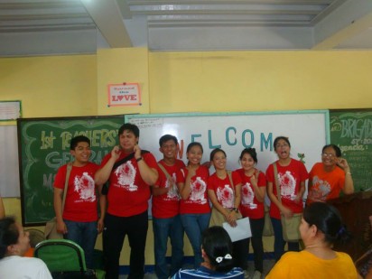 Teachers Neil, Kilo, Emil, Mikee, Cris, Adelaide and Reg pose for a wacky photo with their principal, Dorotea Eseller.