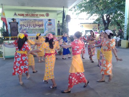 The female teachers of Pasong Tamo Elementary School perform during the Linggo ng Wika celebration last August.