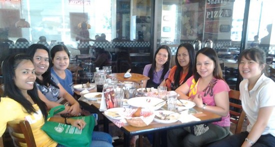 Teacher Brigitte shares a meal with her co-teachers from Pasong Tamo Elementary School.