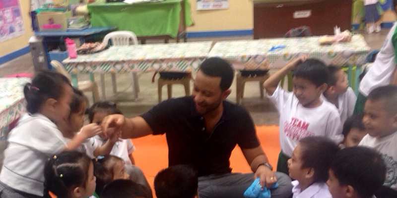 John Legend with students and teachers of a Kindergarten Class at Highway Hills Integrated School